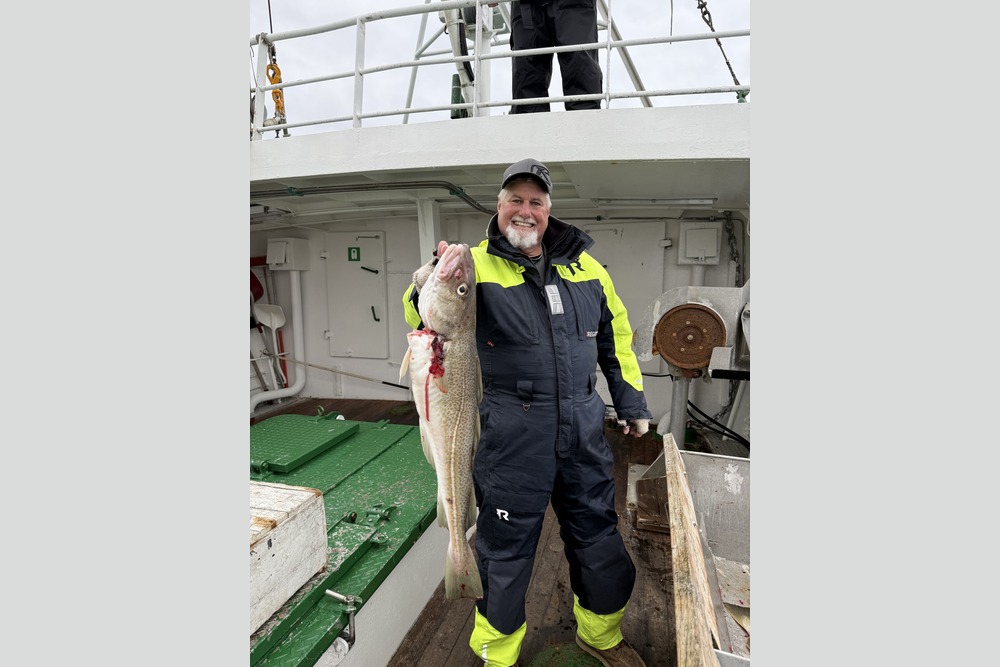 John Wente posing with a fish during deep-sea fishing in Nusfjord, Norway.